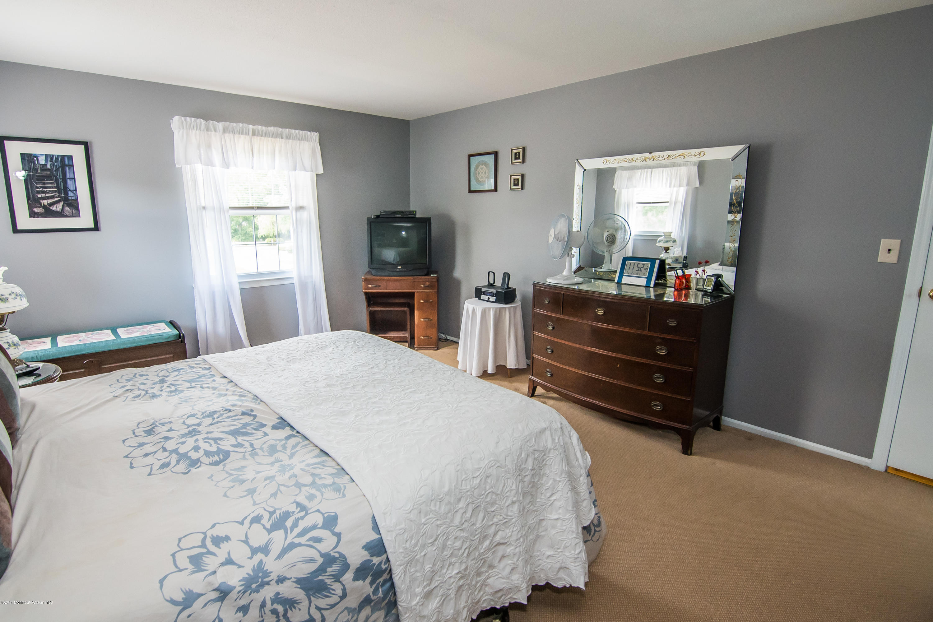 22 Old Post Road Freehold, NJ 07728 - Photo 35 of 61 a bedroom with a bed and a flat tv screen on the dresser