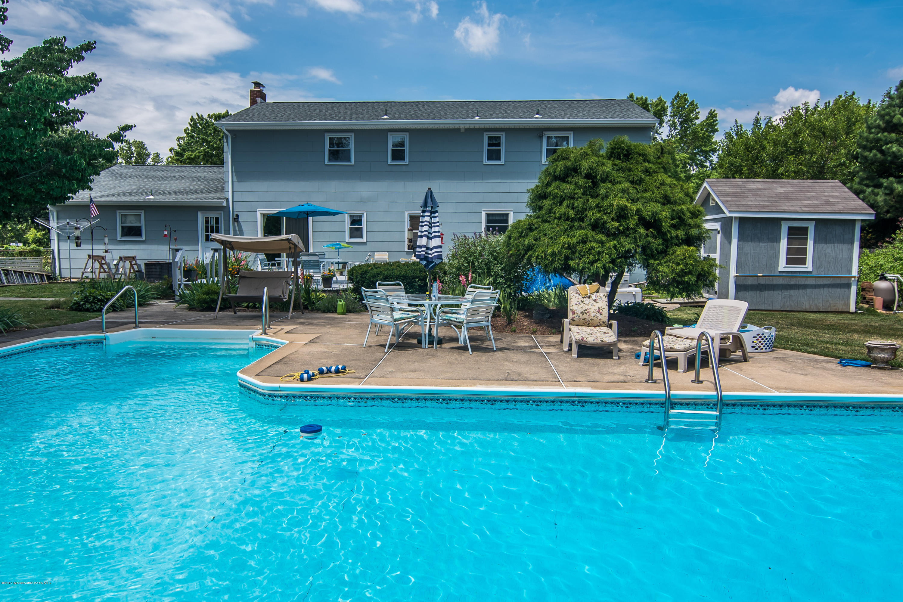 22 Old Post Road Freehold, NJ 07728 - Photo 46 of 61 a house view with a sitting space and garden