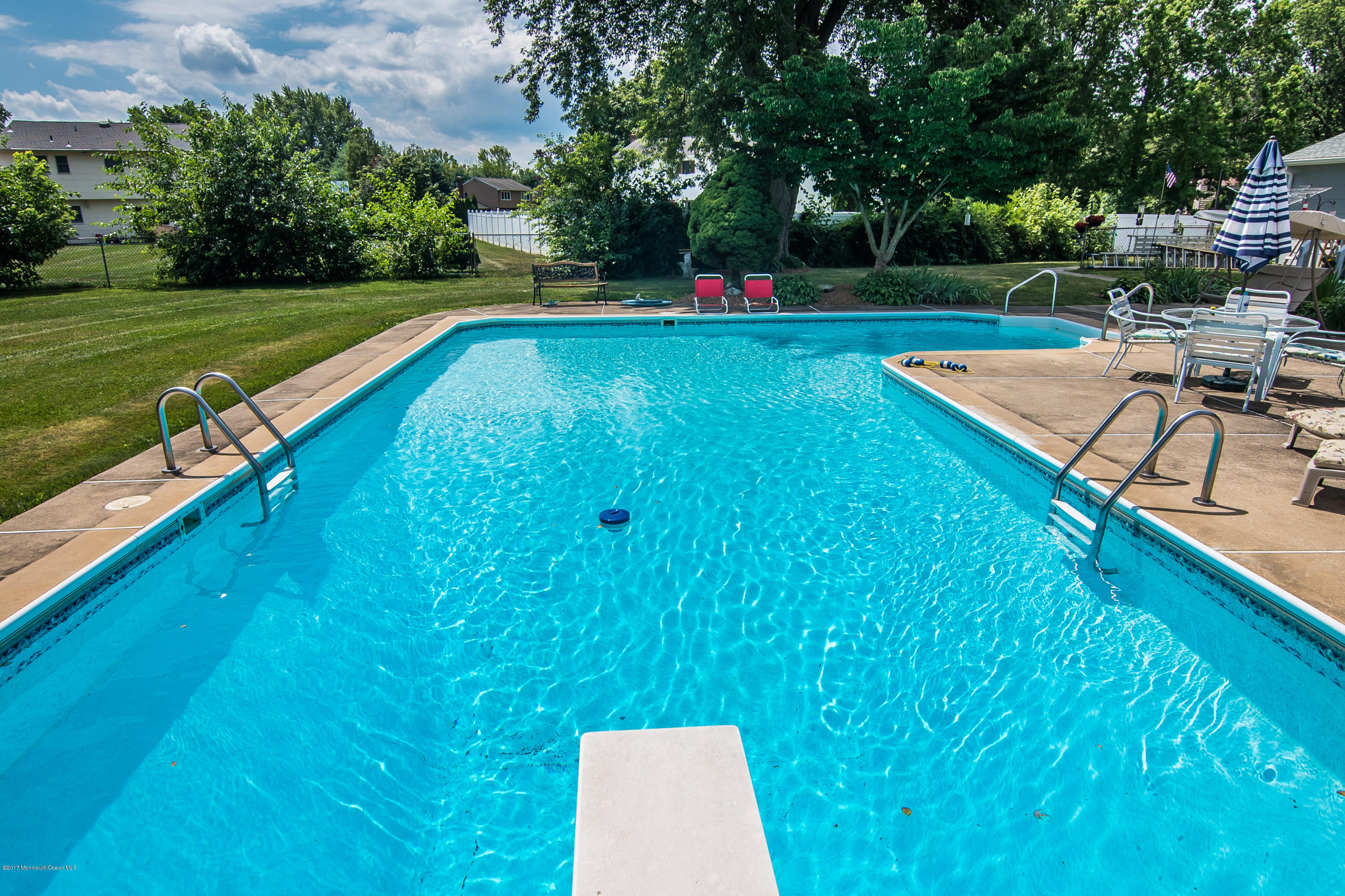 22 Old Post Road Freehold, NJ 07728 - Photo 47 of 61 a view of a backyard with swimming pool