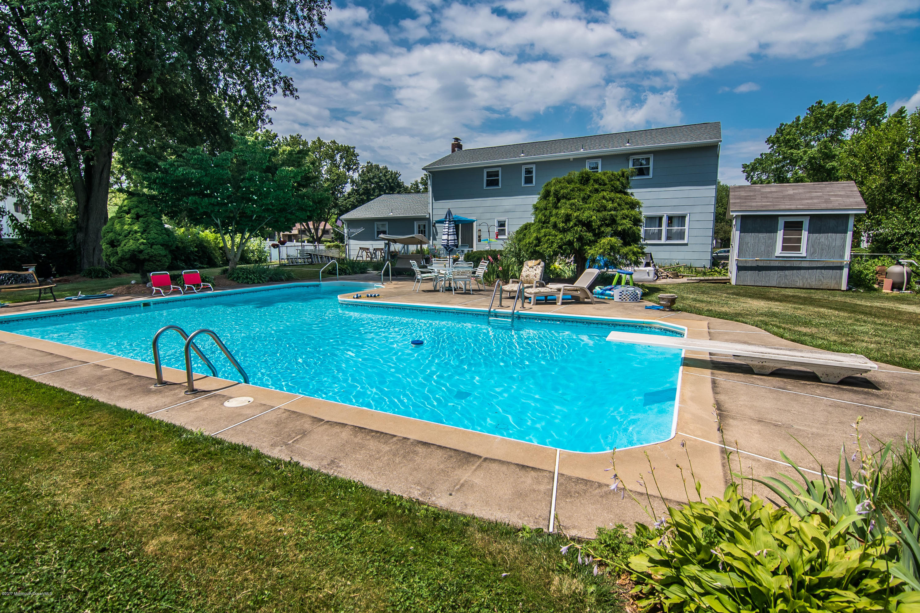 22 Old Post Road Freehold, NJ 07728 - Photo 49 of 61 a view of a house with backyard and swimming pool