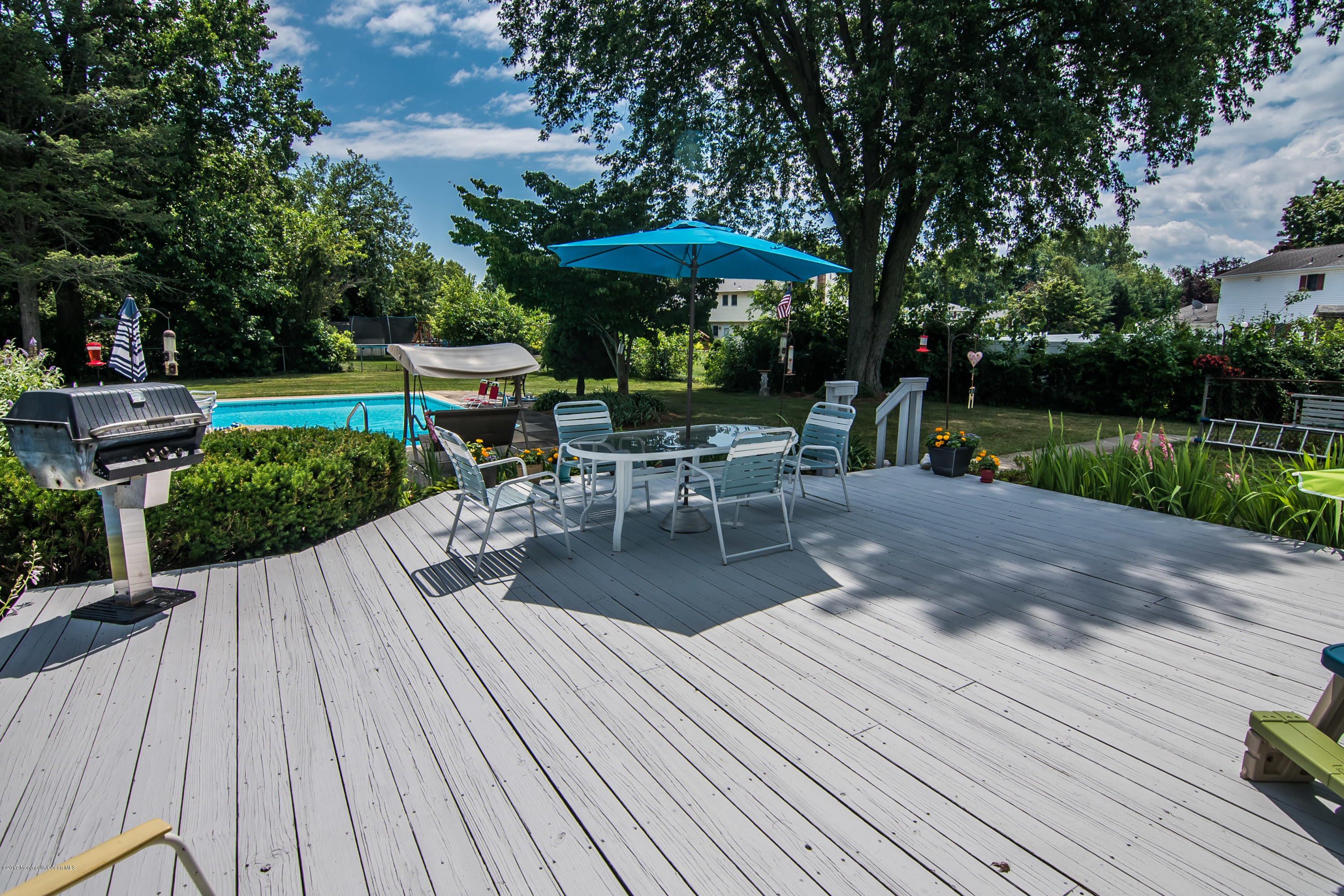 22 Old Post Road Freehold, NJ 07728 - Photo 56 of 61 a view of a table and chairs on the roof deck