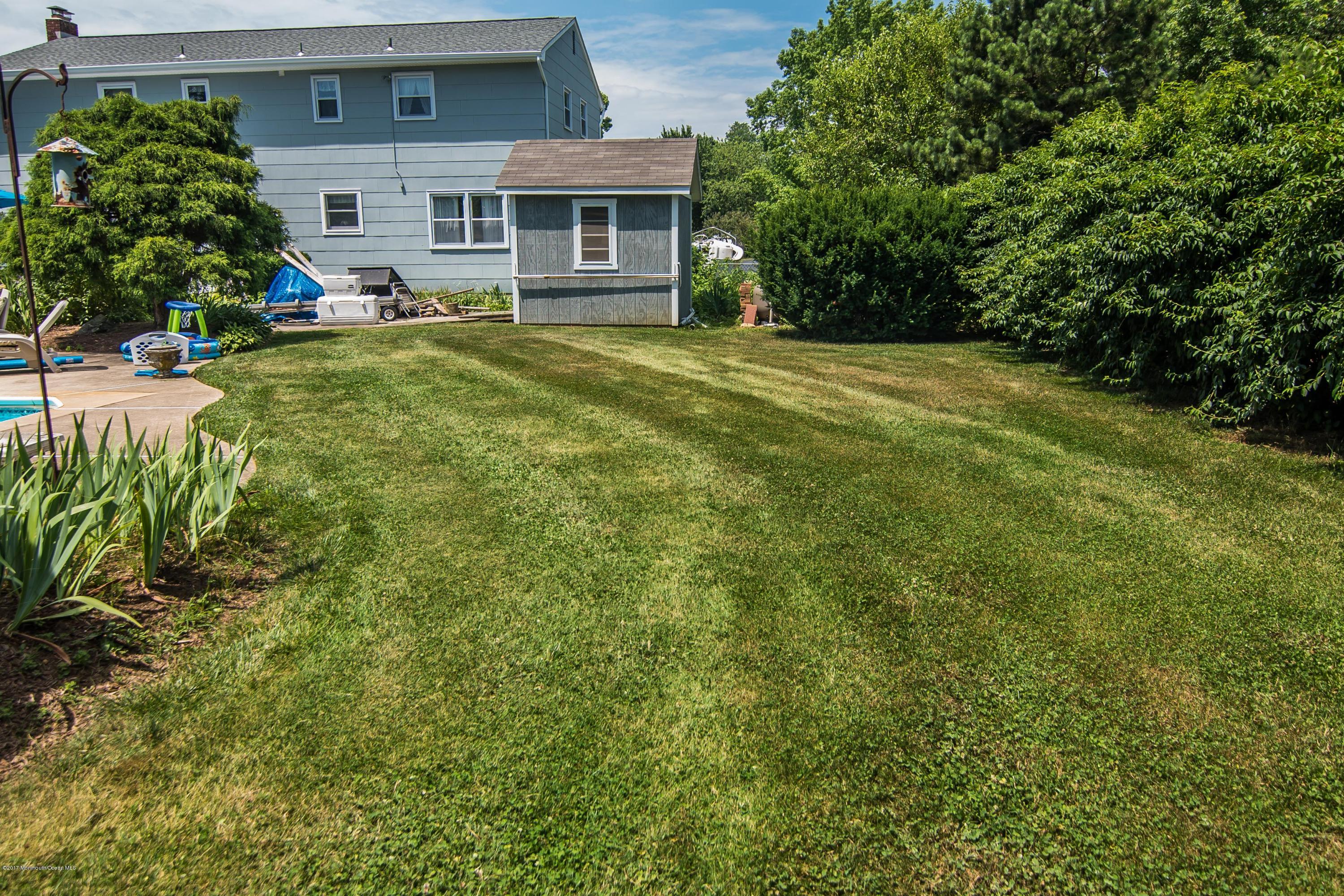 22 Old Post Road Freehold, NJ 07728 - Photo 60 of 61 a front view of a house with a yard