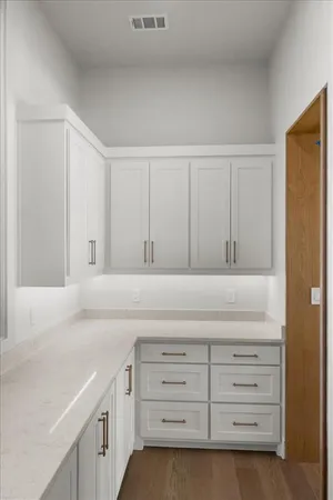 a kitchen with cabinets appliances and cabinets