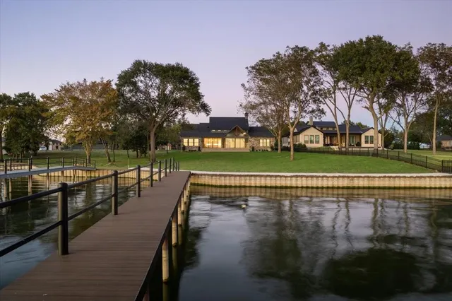 a view of swimming pool with outdoor space and lake view