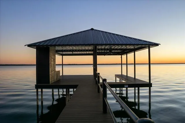 a view of a balcony with furniture and wooden floor