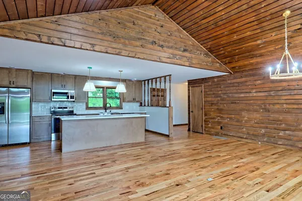 a view of a living room and a wooden floor