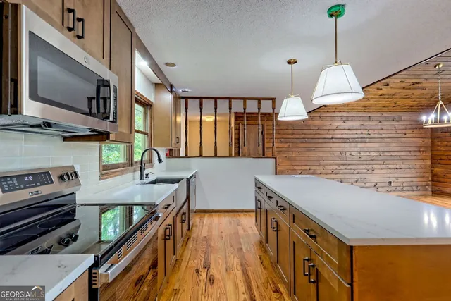 a bathroom with a sink a toilet and a bathtub