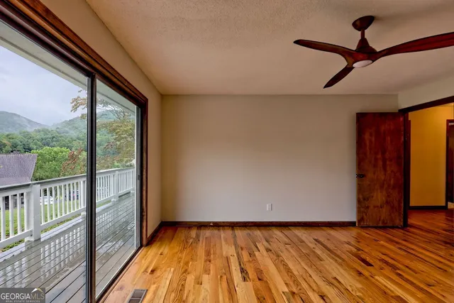 a bathroom with a shower and a toilet