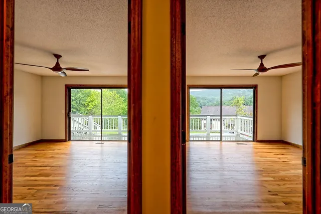 a view of a balcony with wooden floor