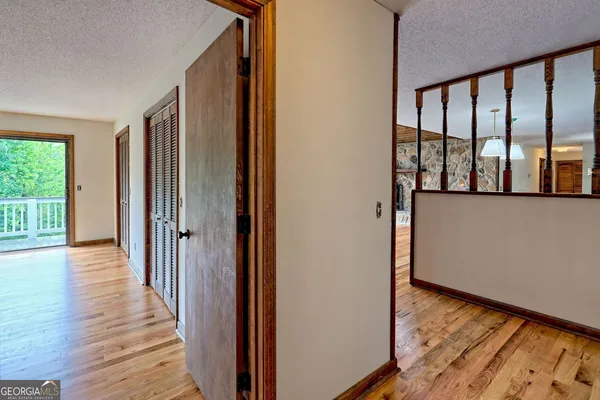 an aerial view of a house with swimming pool garden and patio