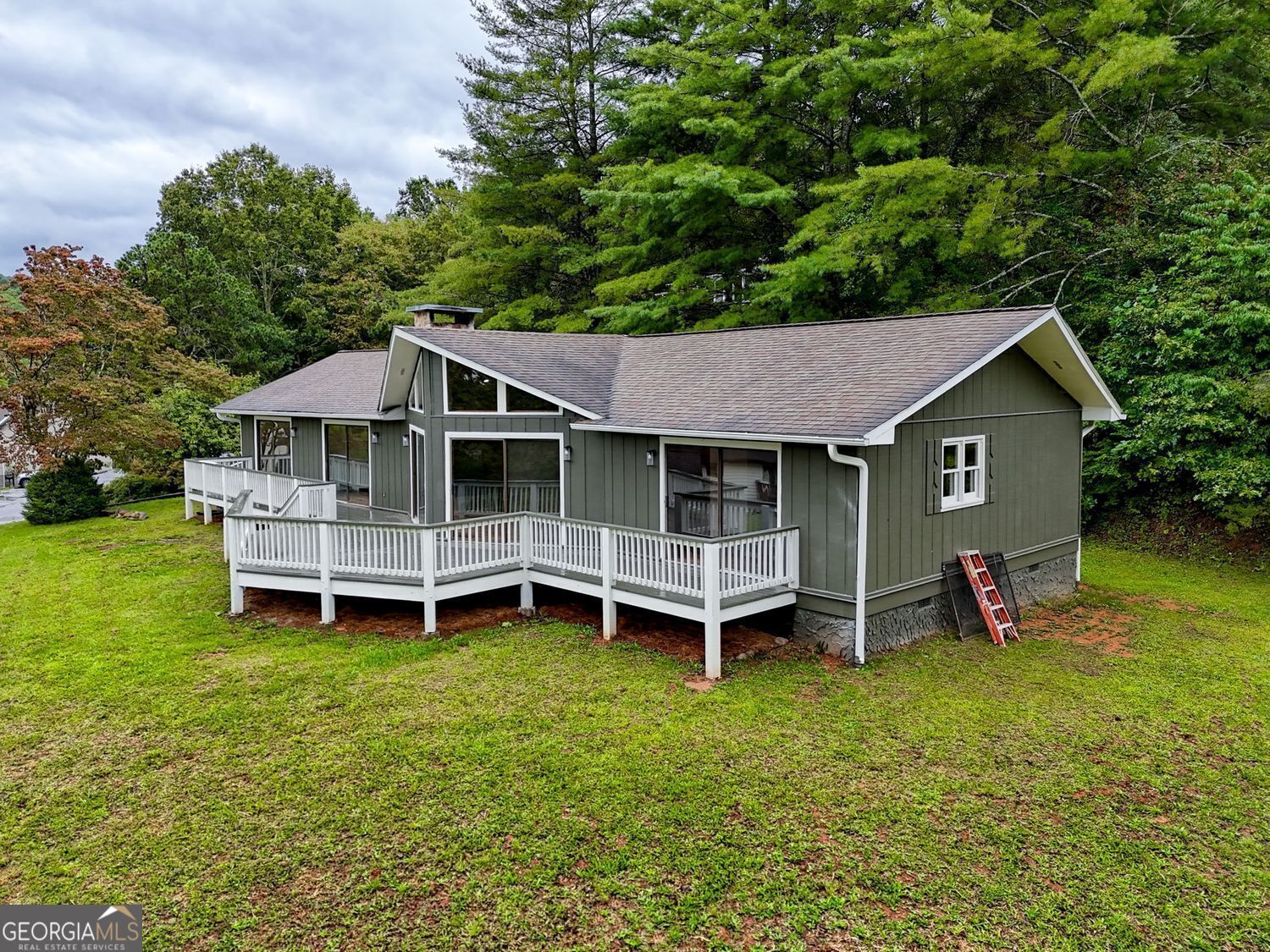156 Tahoe Lane Dillard, GA 30537 - Photo 5 of 76 an aerial view of a house with a garden and deck