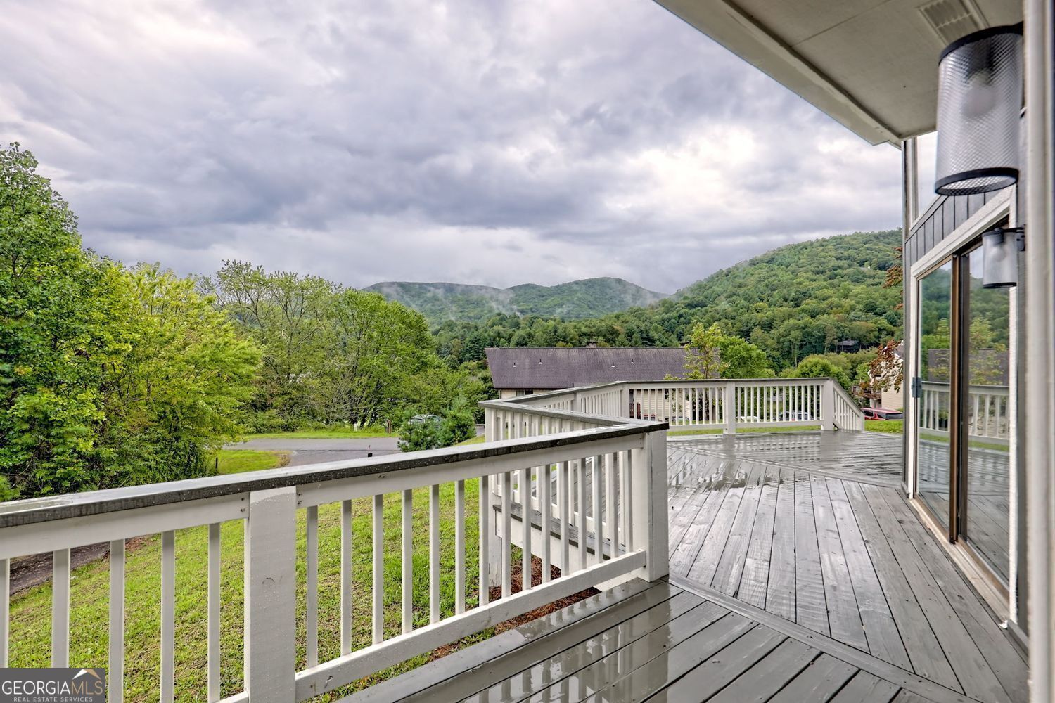 156 Tahoe Lane Dillard, GA 30537 - Photo 56 of 76 a balcony with wooden floor and city view