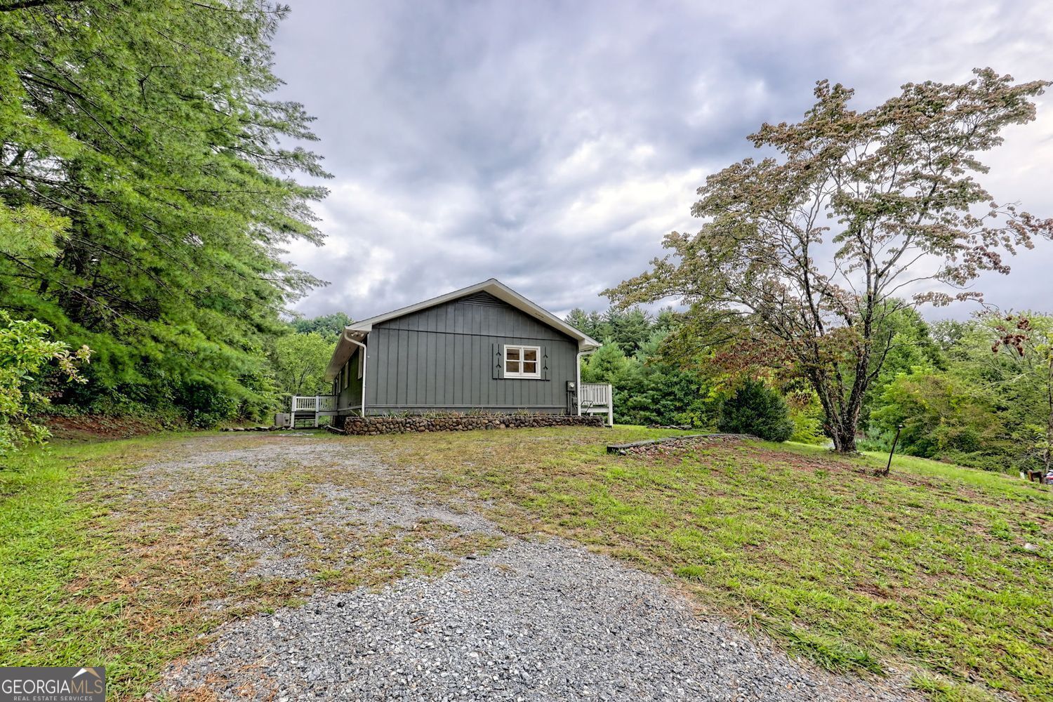 156 Tahoe Lane Dillard, GA 30537 - Photo 66 of 76 a house with trees in front of it