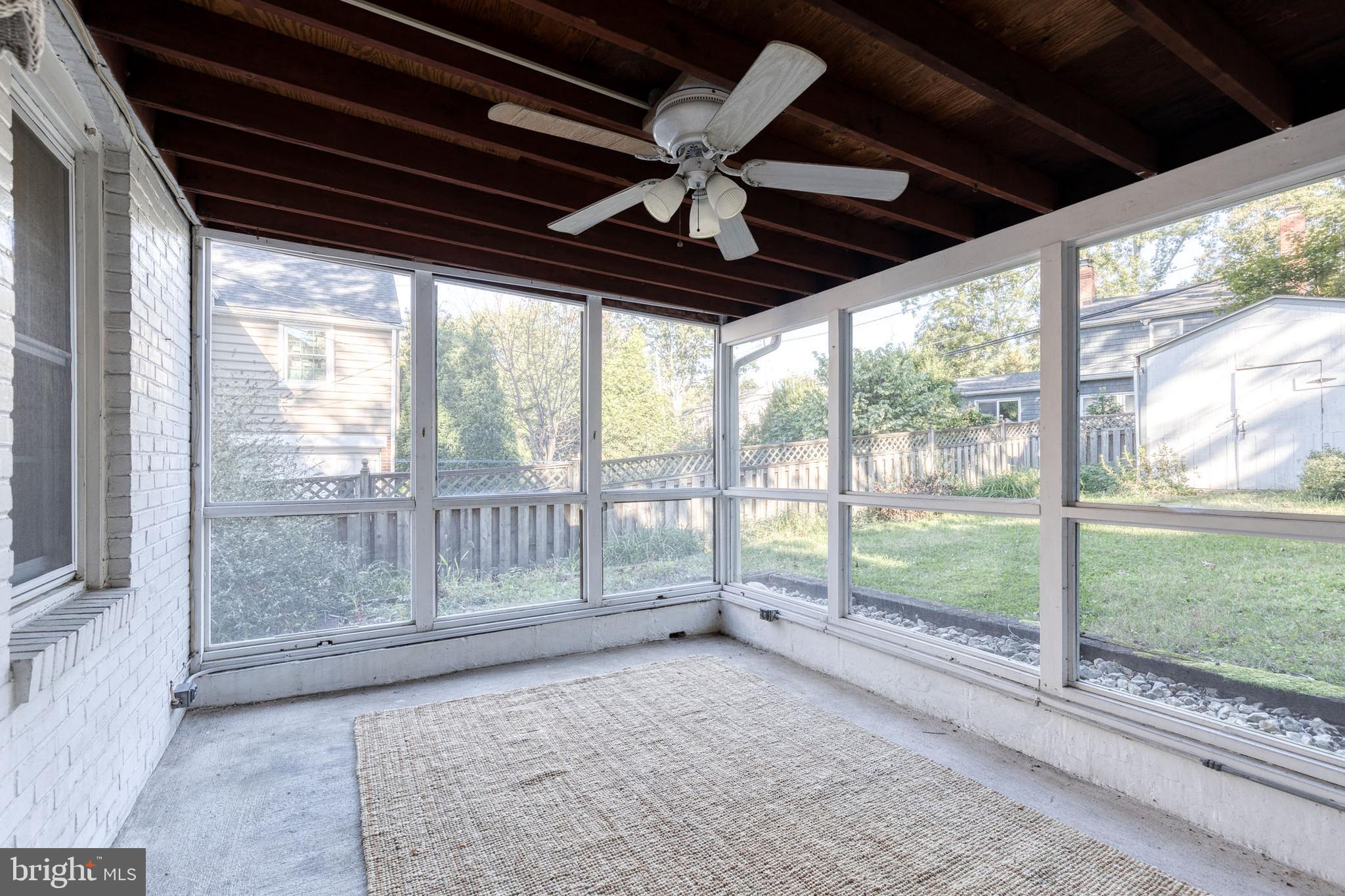 724 Murdock Road Baltimore, MD 21212 - Photo 20 of 42 a view of an empty room with wooden floor and a ceiling fan
