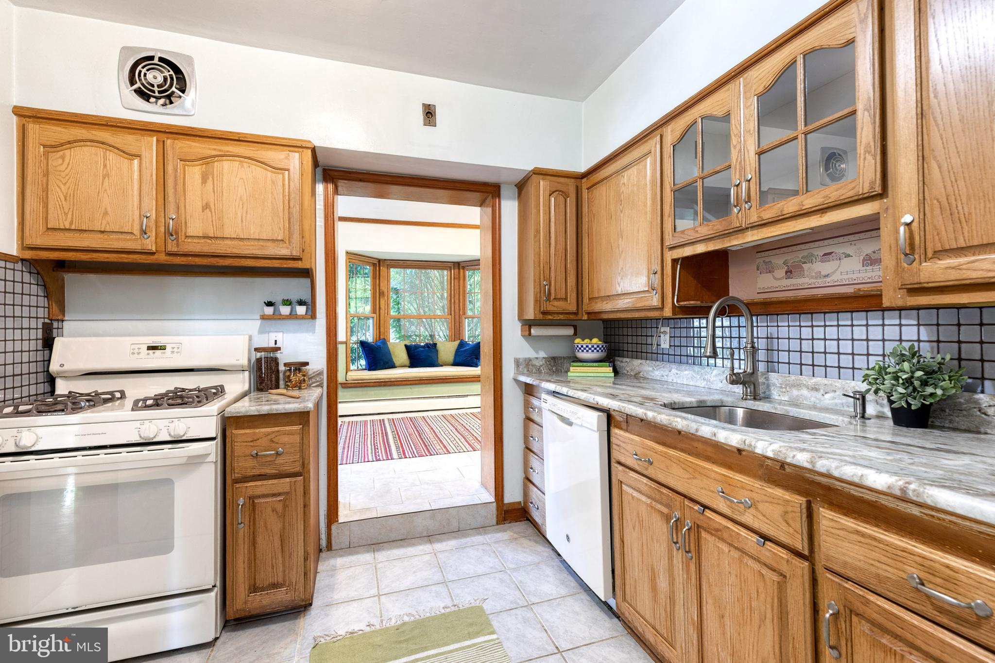 724 Murdock Road Baltimore, MD 21212 - Photo 5 of 42 a kitchen with stainless steel appliances granite countertop a stove and a sink