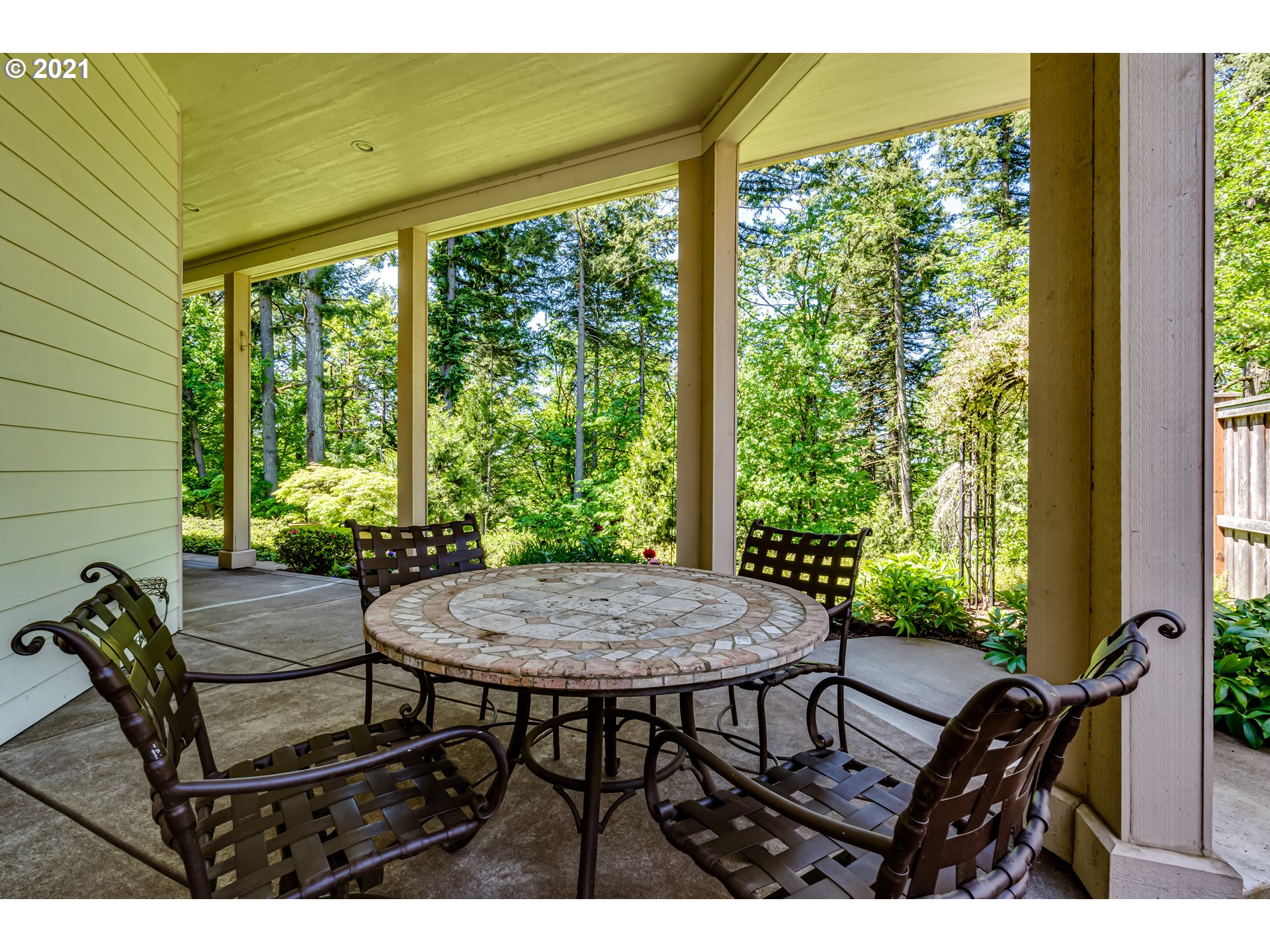6128 Graystone Loop Springfield, OR 97478 - Photo 23 of 32 a view of a patio with table and chairs