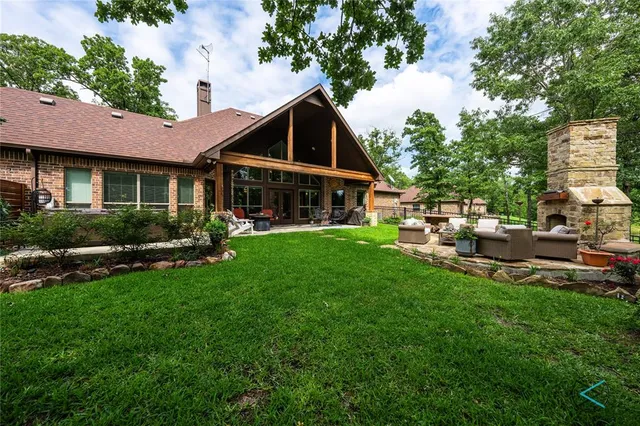 a view of a house with a yard porch and sitting area