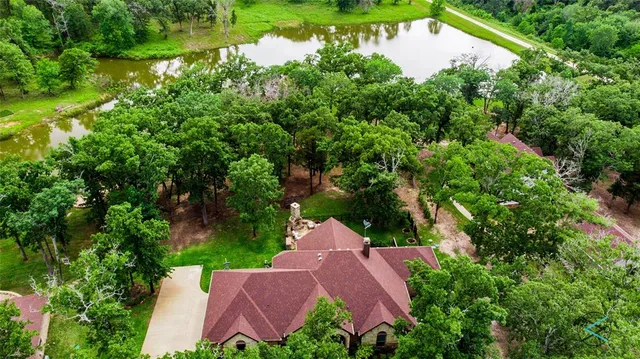 an aerial view of house with yard
