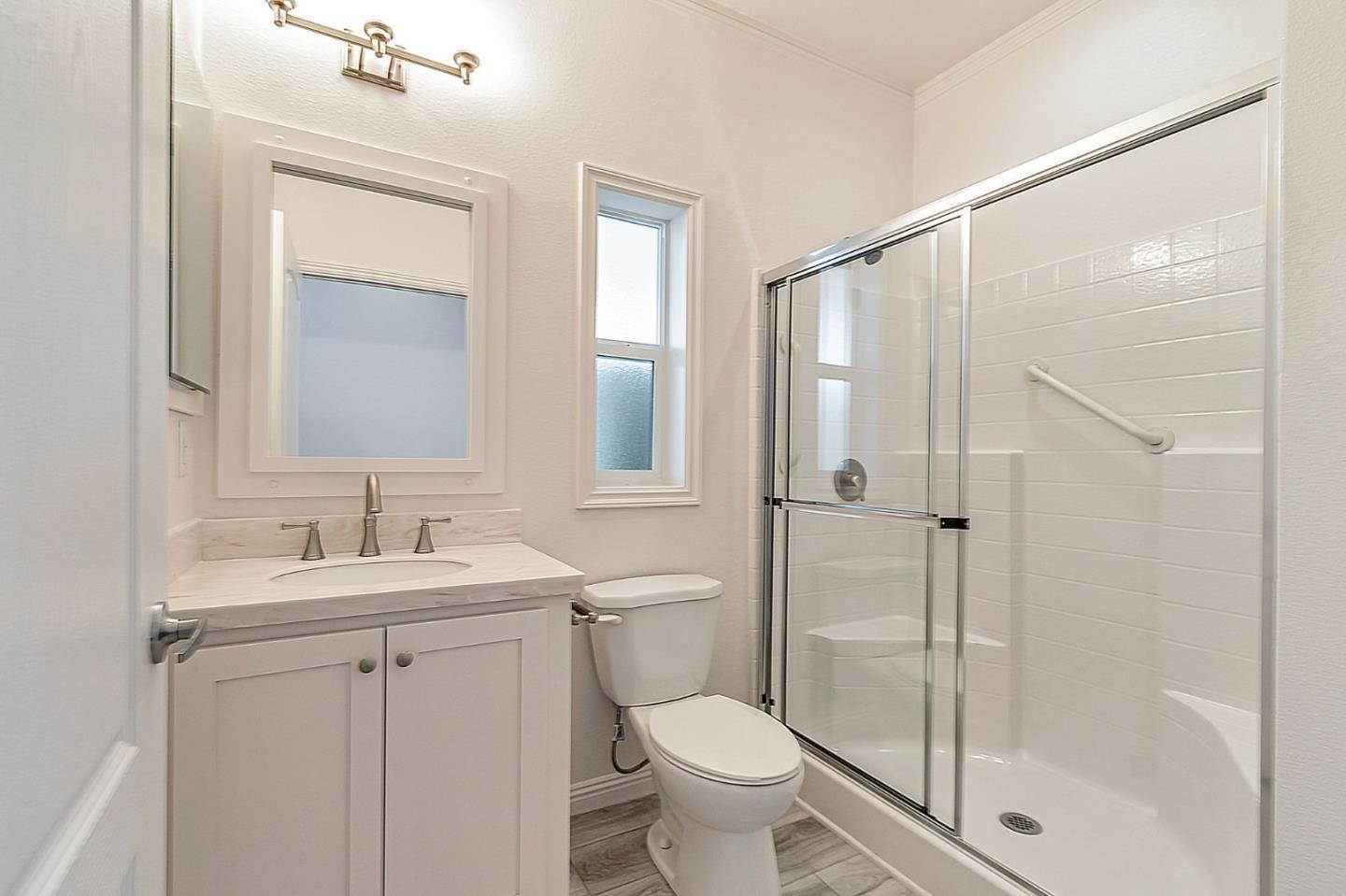 2150 Almaden Road, Unit 147 San Jose, CA 95125 - Photo 23 of 29 a bathroom with a shower sink vanity mirror and toilet