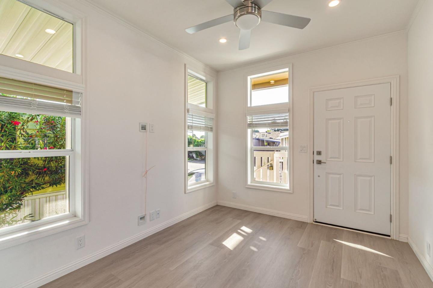 2150 Almaden Road, Unit 147 San Jose, CA 95125 - Photo 6 of 29 a view of an empty room with a window and wooden floor
