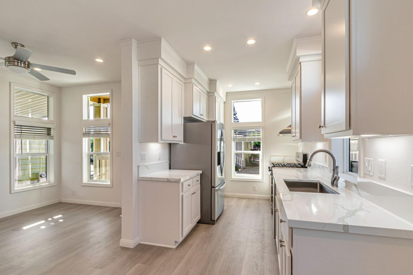 2150 Almaden Road, Unit 147 San Jose, CA 95125 - Photo 9 of 29 a kitchen with stainless steel appliances granite countertop a sink refrigerator and cabinets
