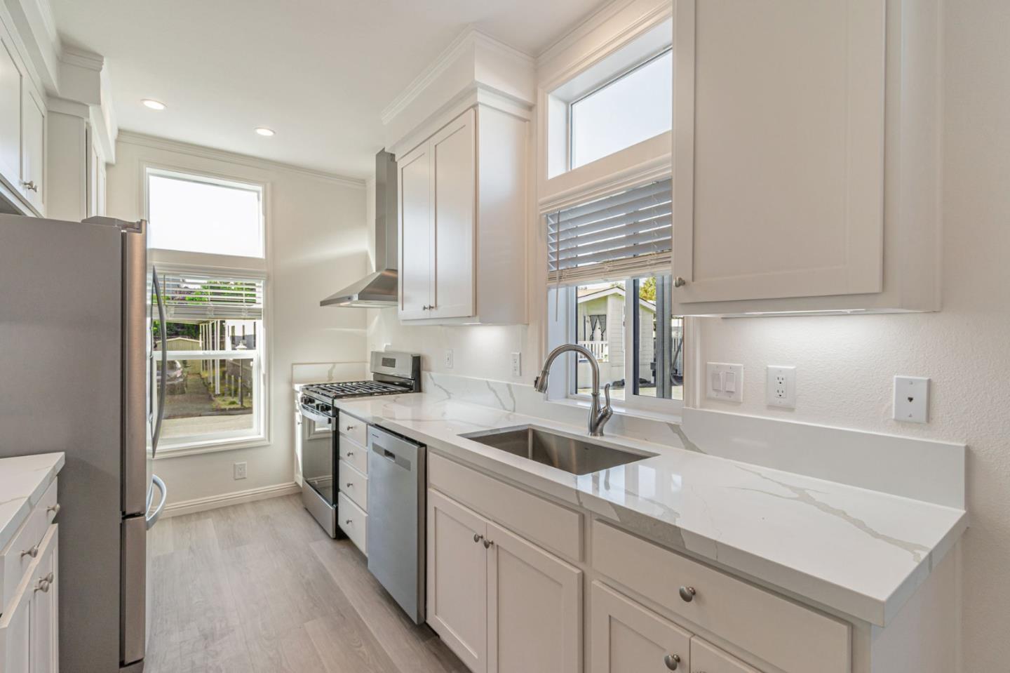 2150 Almaden Road, Unit 147 San Jose, CA 95125 - Photo 10 of 29 a kitchen with a sink cabinets stainless steel appliances and a window