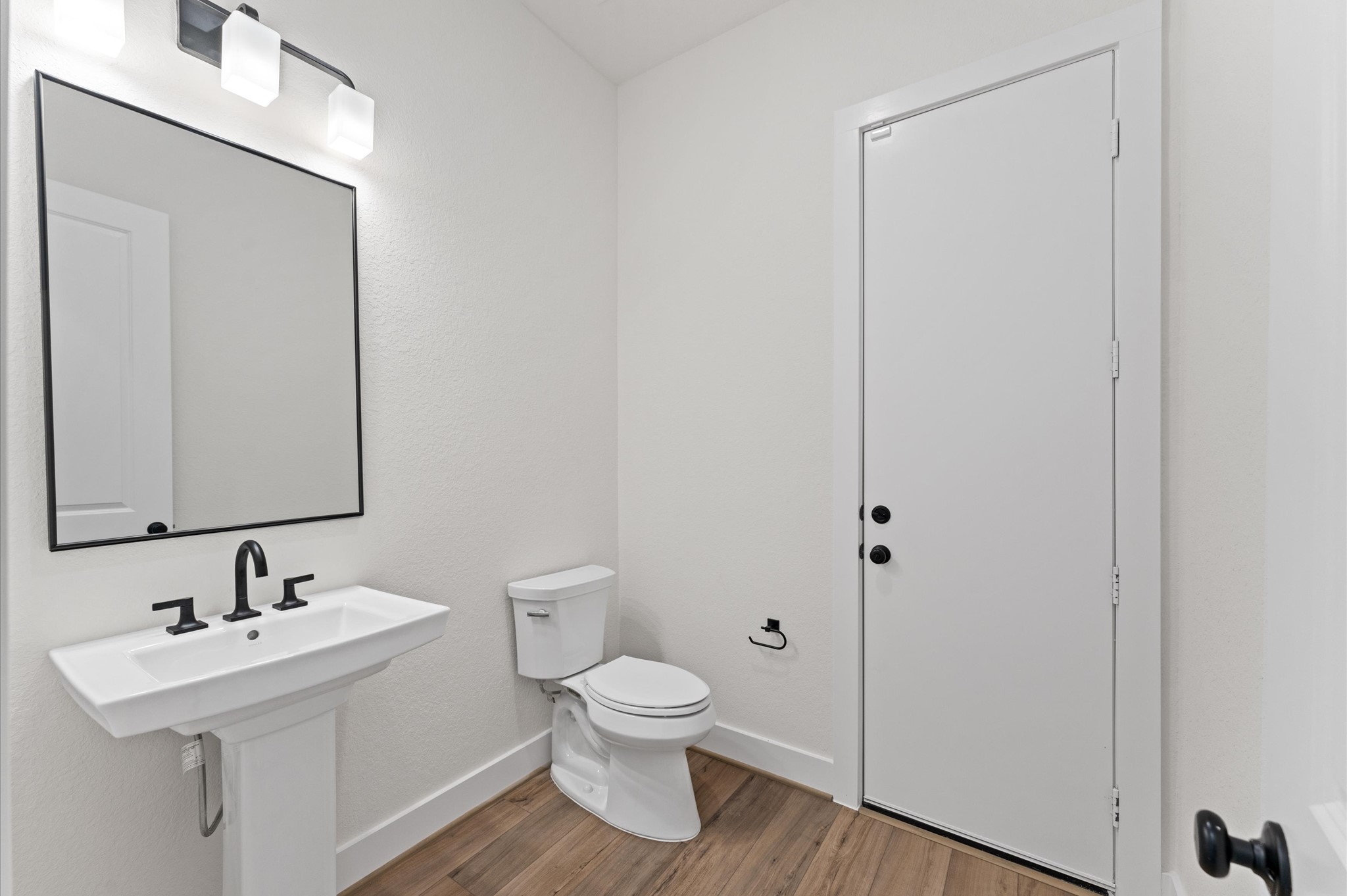 8218 Sherman Pk Trail Spring, TX 77389 - Photo 11 of 28 a bathroom with a toilet a sink and mirror