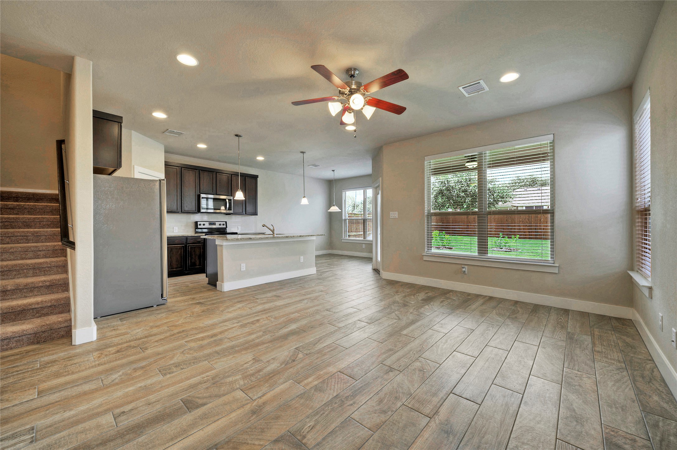 508 High Tech Drive, Unit B Georgetown, TX 78626 - Photo 3 of 24 An open concept design seamlessly connects the well-appointed kitchen with the spacious living area.