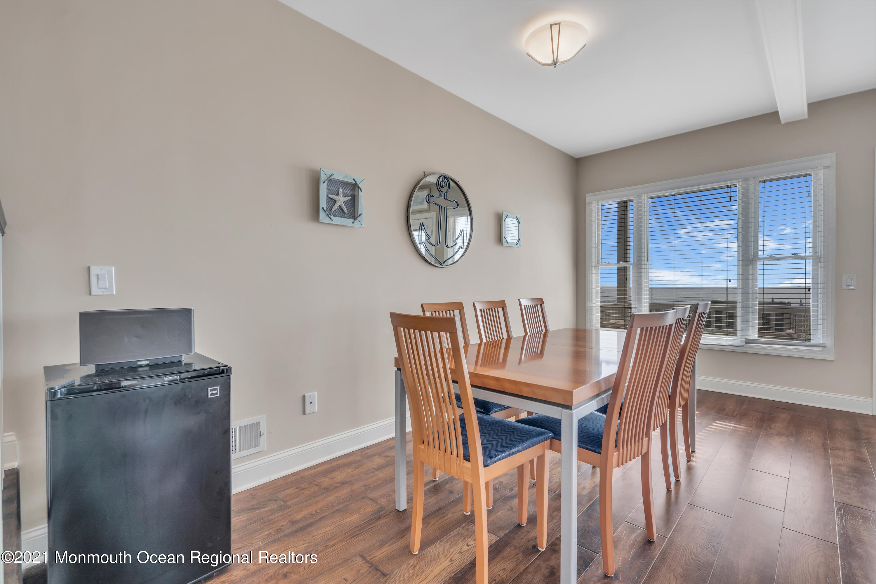 369 Beach Front Manasquan, NJ 08736 - Photo 14 of 49 a view of a dining room with furniture window and wooden floor