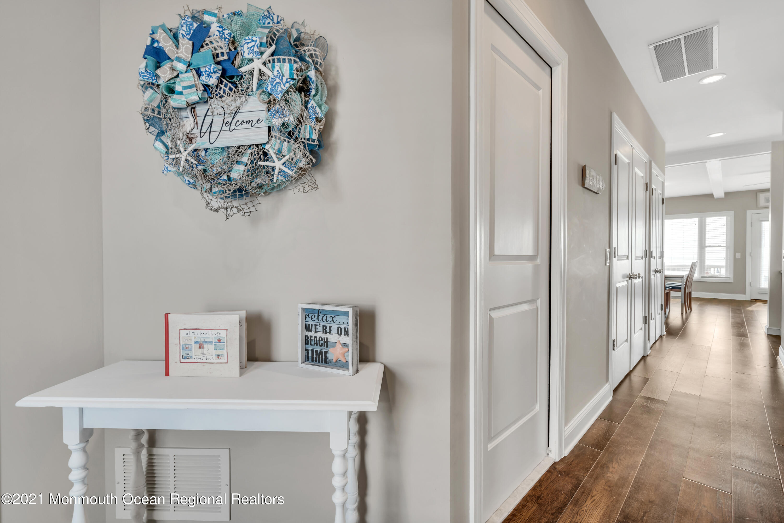 369 Beach Front Manasquan, NJ 08736 - Photo 17 of 49 a view of a hallway with a chandelier
