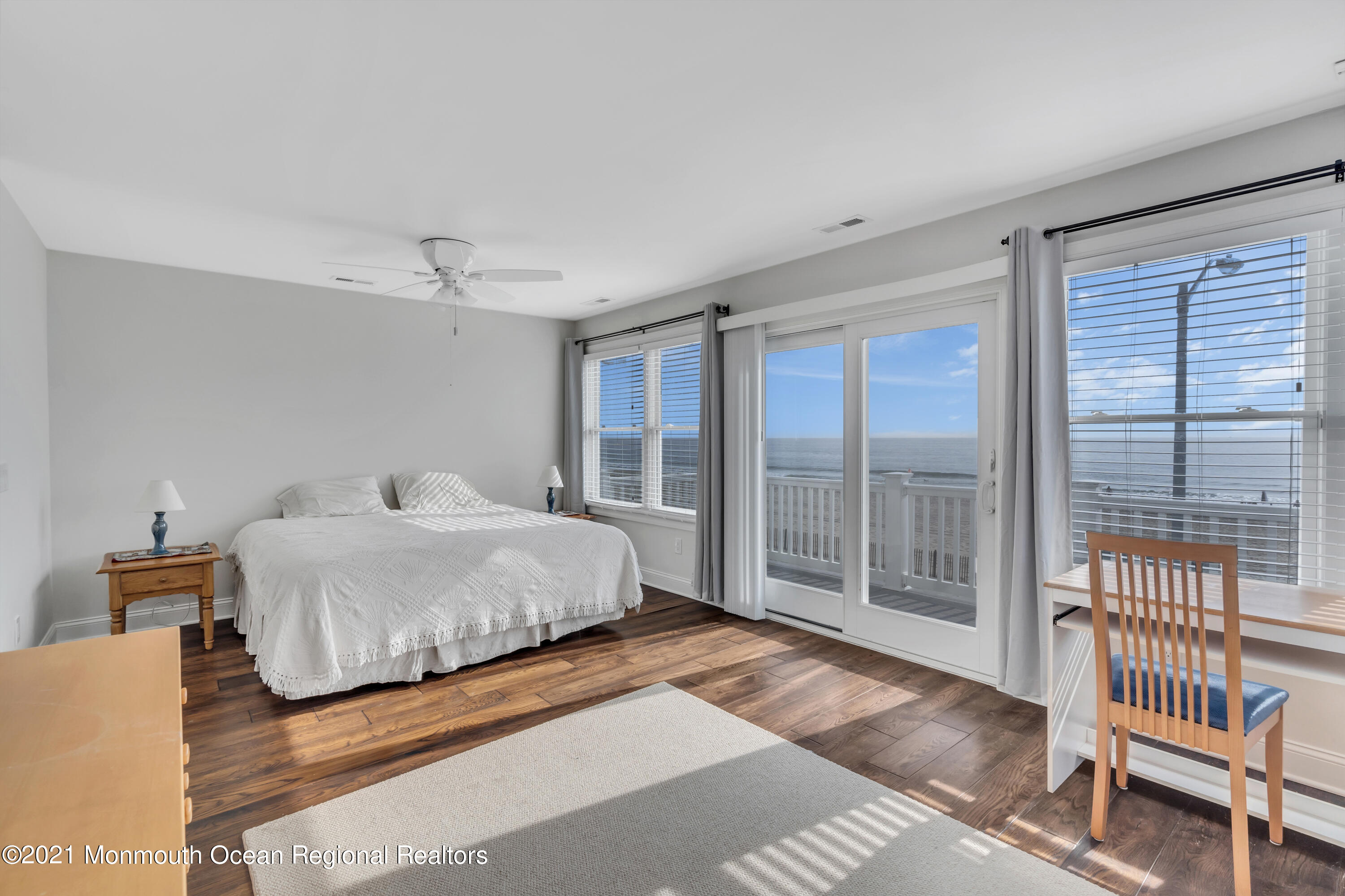 369 Beach Front Manasquan, NJ 08736 - Photo 22 of 49 a spacious bedroom with a bed and a large window