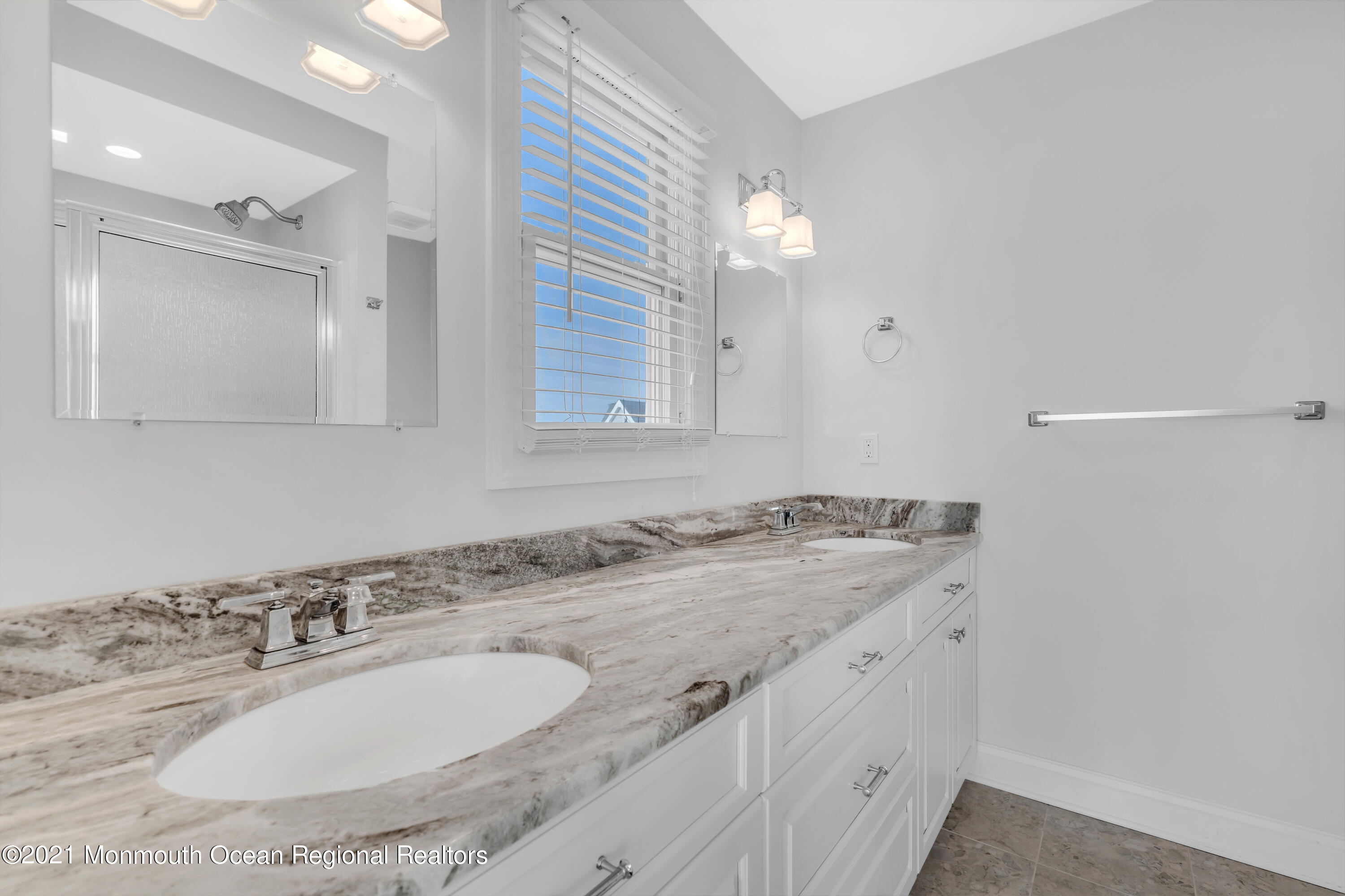 369 Beach Front Manasquan, NJ 08736 - Photo 23 of 49 a bathroom with a granite countertop sink and a mirror