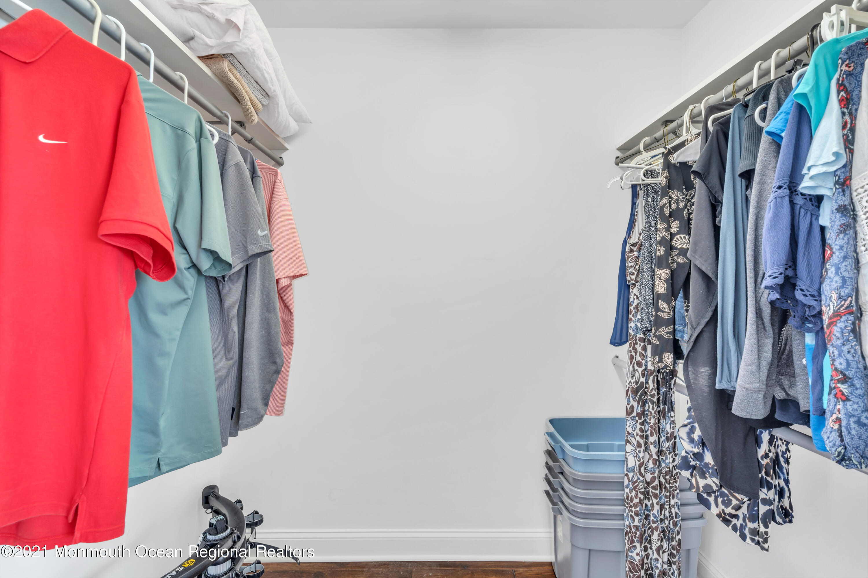 369 Beach Front Manasquan, NJ 08736 - Photo 24 of 49 a view of walk in closet with clothes and shoes