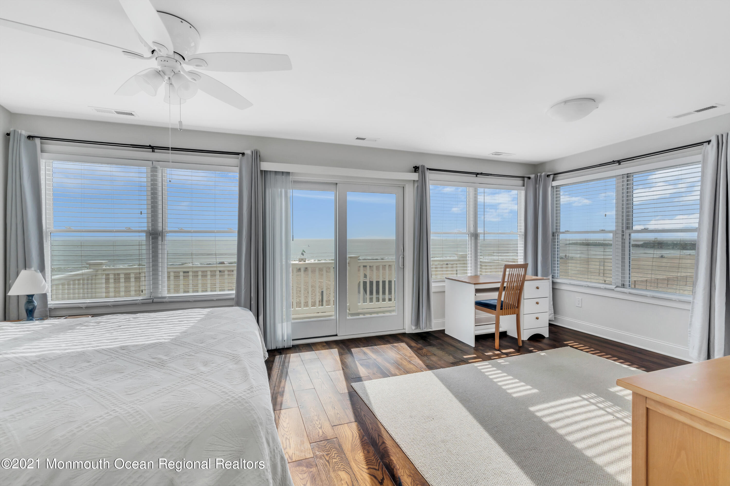 369 Beach Front Manasquan, NJ 08736 - Photo 25 of 49 a spacious bedroom with a large bed and a large window