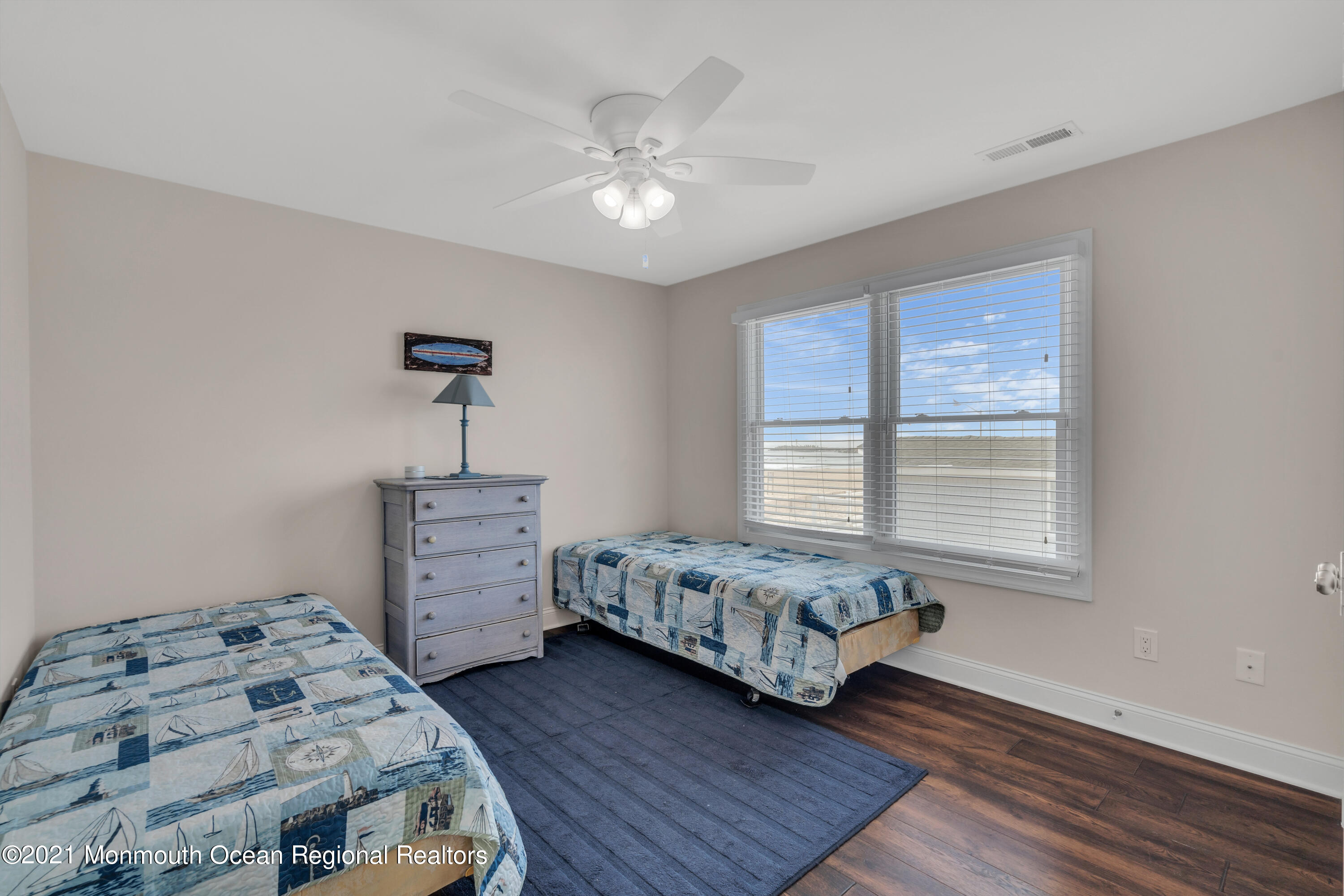 369 Beach Front Manasquan, NJ 08736 - Photo 28 of 49 a bedroom with a bed and a window