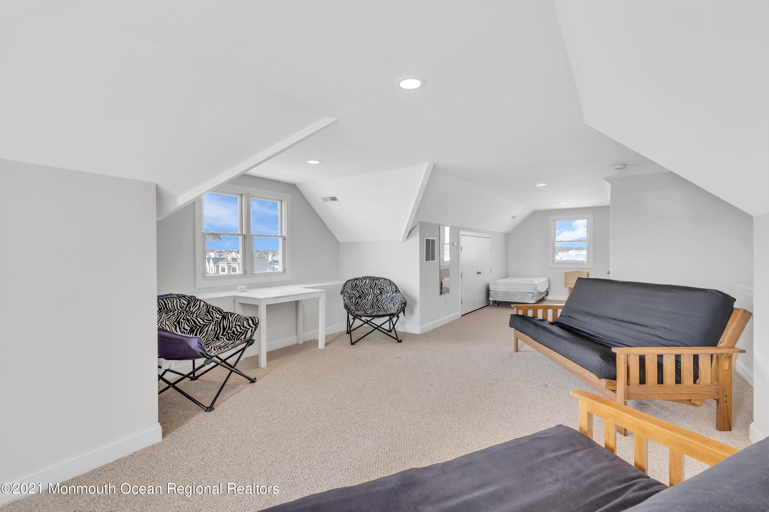 369 Beach Front Manasquan, NJ 08736 - Photo 32 of 49 a bedroom with furniture and a wooden floor