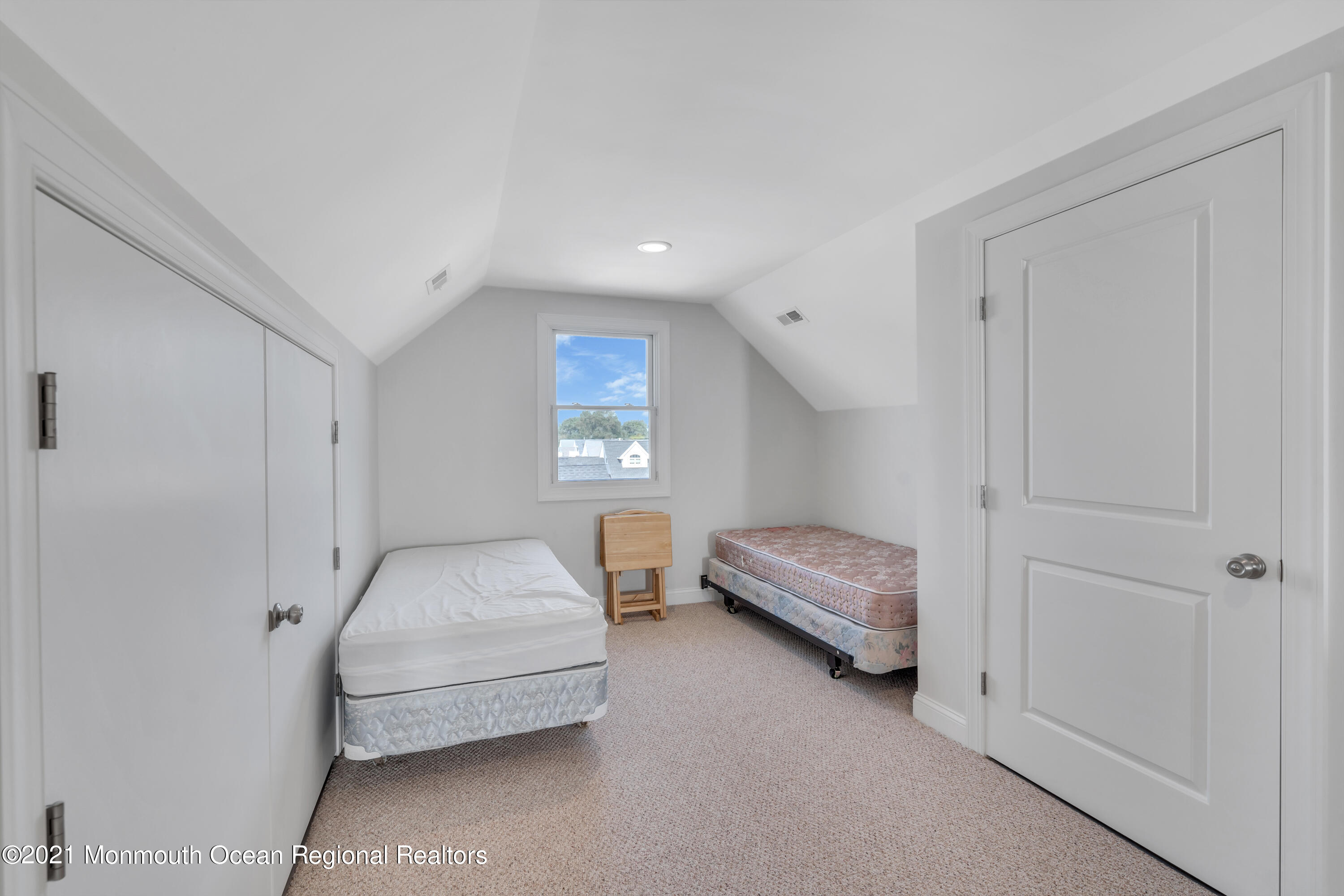 369 Beach Front Manasquan, NJ 08736 - Photo 33 of 49 a bedroom with a bed and a window