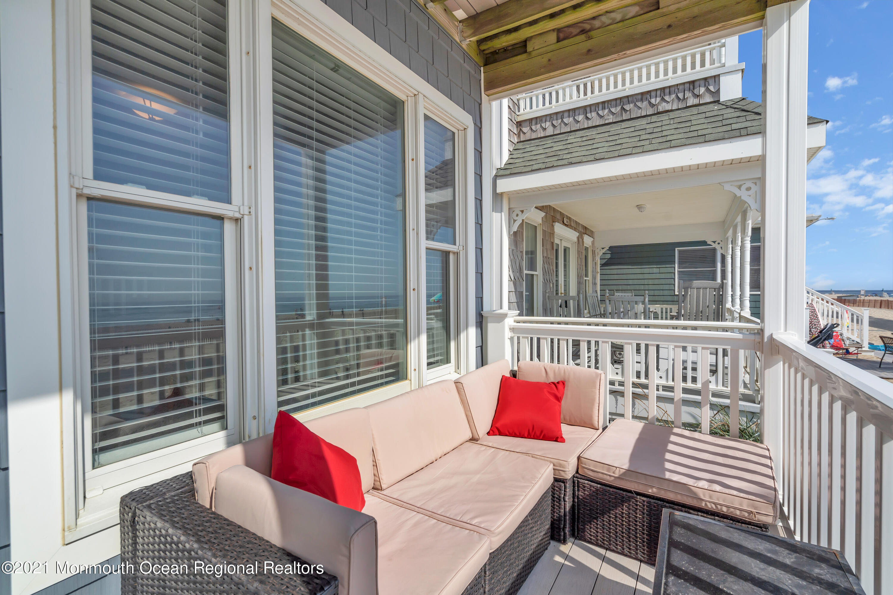 369 Beach Front Manasquan, NJ 08736 - Photo 5 of 49 a view of a deck with couches table and chairs and potted plants