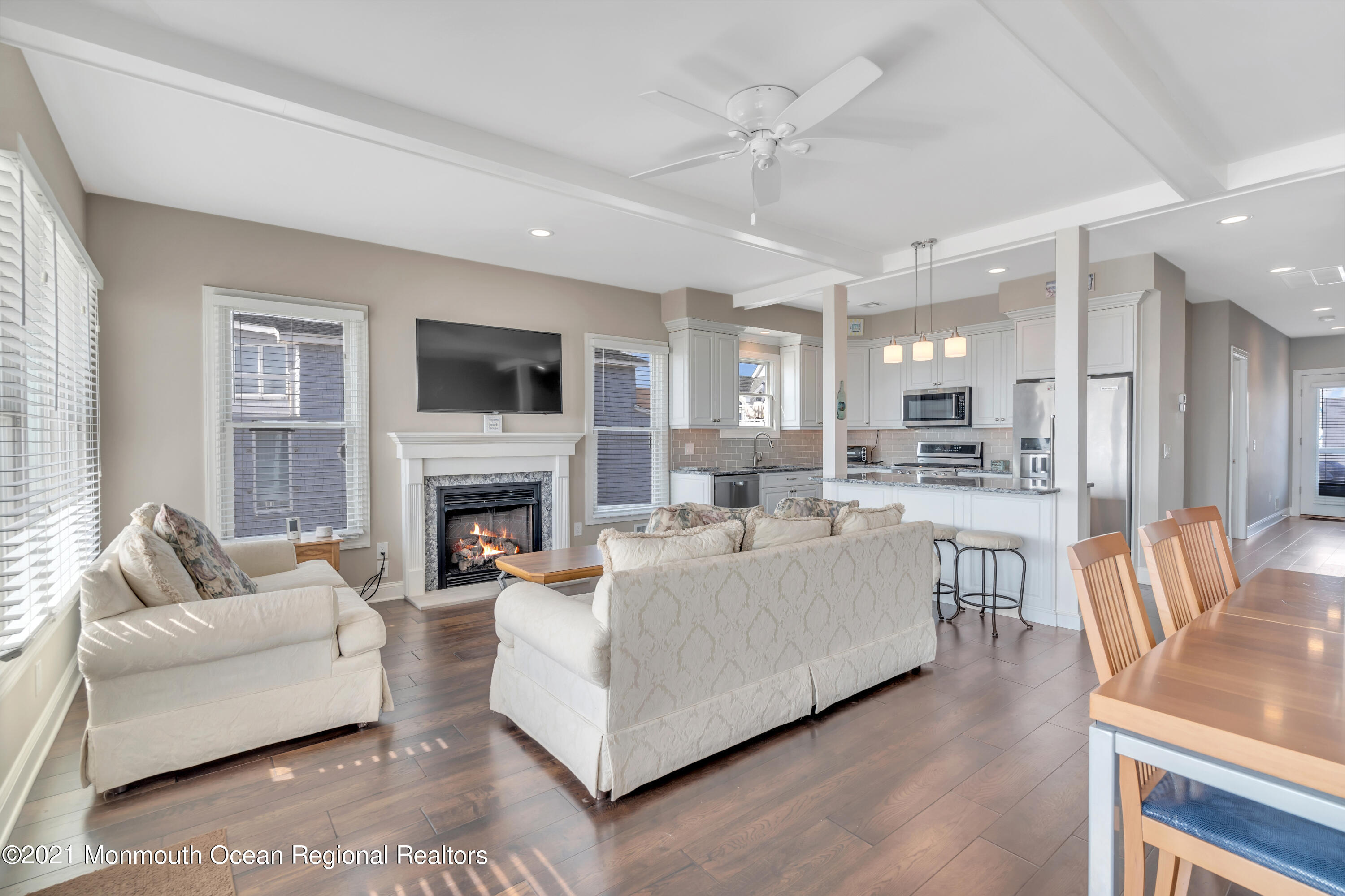 369 Beach Front Manasquan, NJ 08736 - Photo 7 of 49 a living room with furniture a fireplace and a flat screen tv