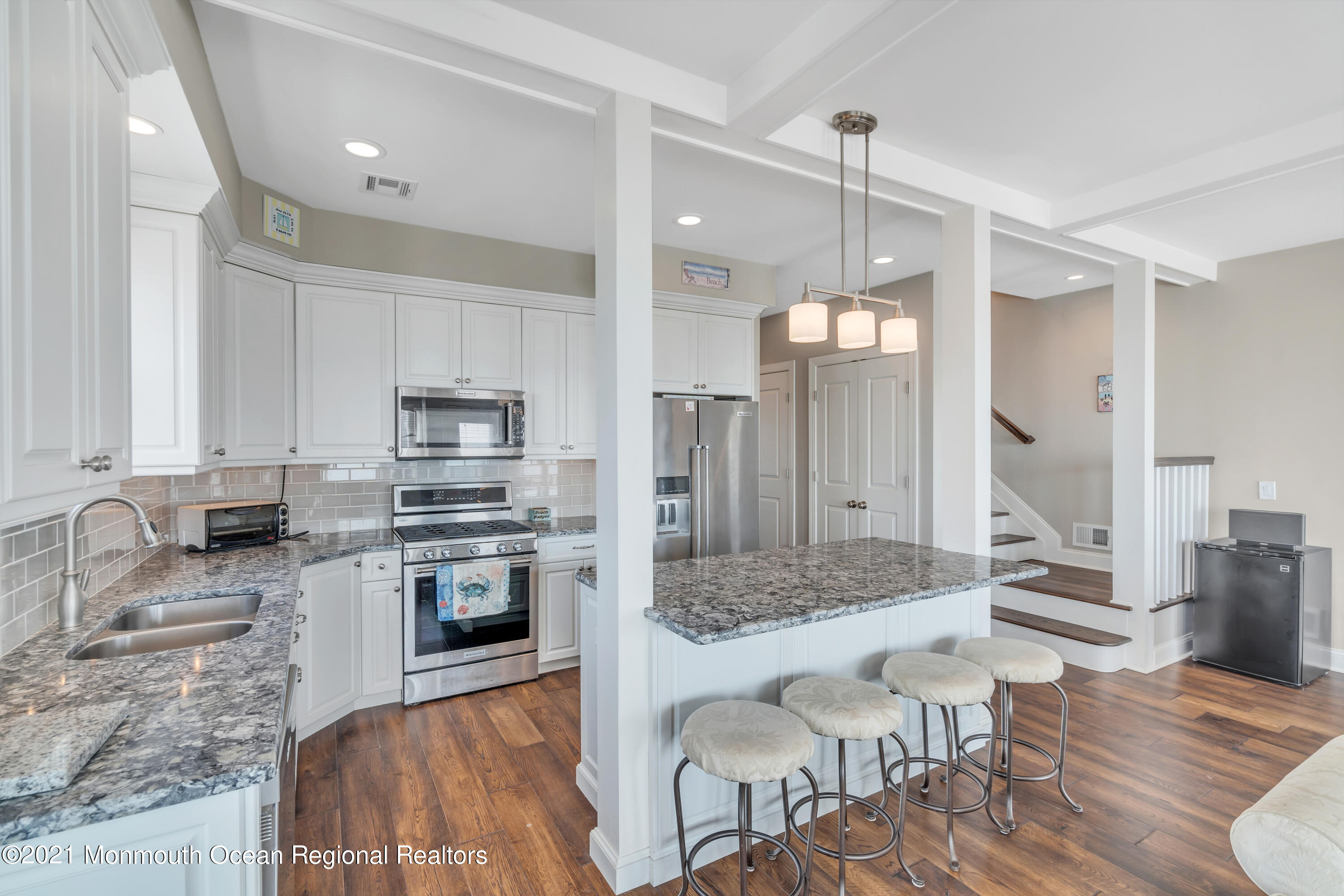 369 Beach Front Manasquan, NJ 08736 - Photo 10 of 49 a large kitchen with granite countertop a large counter top appliances and cabinets