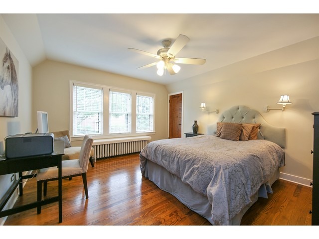719 Arlington Road Riverside, IL 60546 - Photo 15 of 22 a bedroom with a bed and a table in it