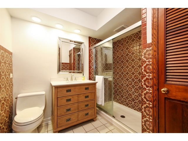 719 Arlington Road Riverside, IL 60546 - Photo 17 of 22 a bathroom with a sink a toilet and shower