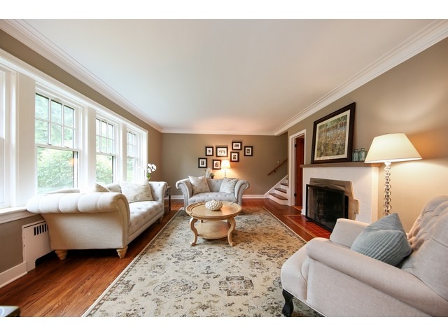 719 Arlington Road Riverside, IL 60546 - Photo 4 of 22 a living room with furniture couches and a fireplace