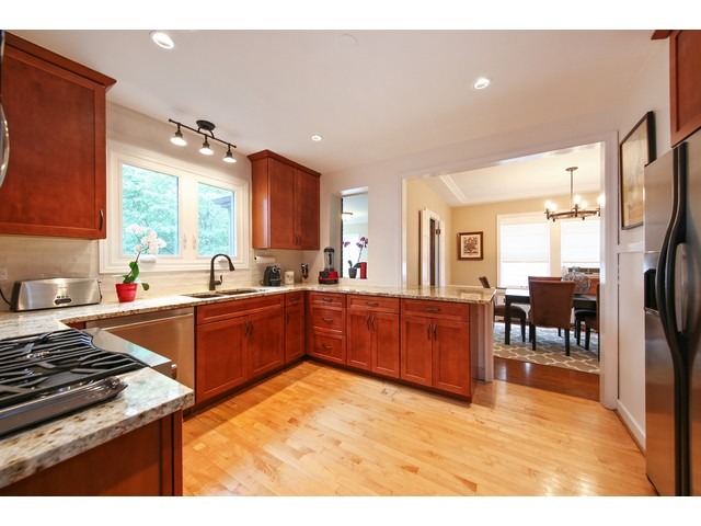 719 Arlington Road Riverside, IL 60546 - Photo 7 of 22 a kitchen with lots of counter top space and stainless steel appliances