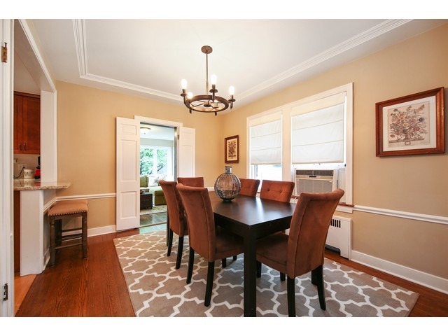 719 Arlington Road Riverside, IL 60546 - Photo 8 of 22 a view of a dining room with furniture window and wooden floor
