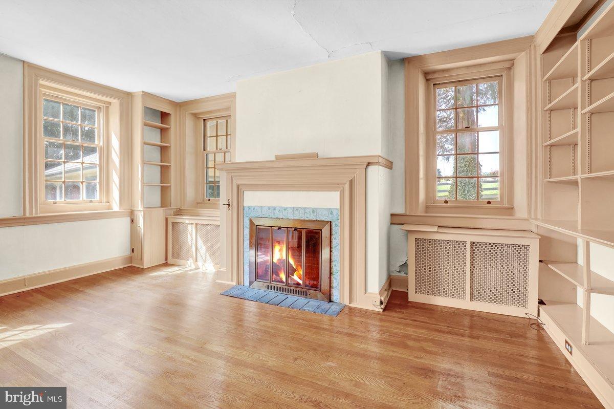 284 Old Mill Road Parkesburg, PA 19365 - Photo 15 of 50 a view of an empty room with a fireplace and a window