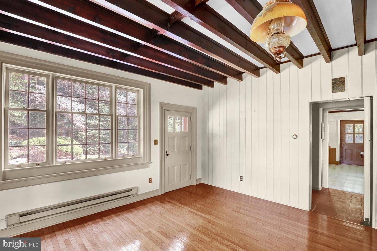 284 Old Mill Road Parkesburg, PA 19365 - Photo 17 of 50 a view of an empty room with wooden floor and windows