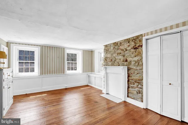 a bathroom with a shower a toilet and a shower