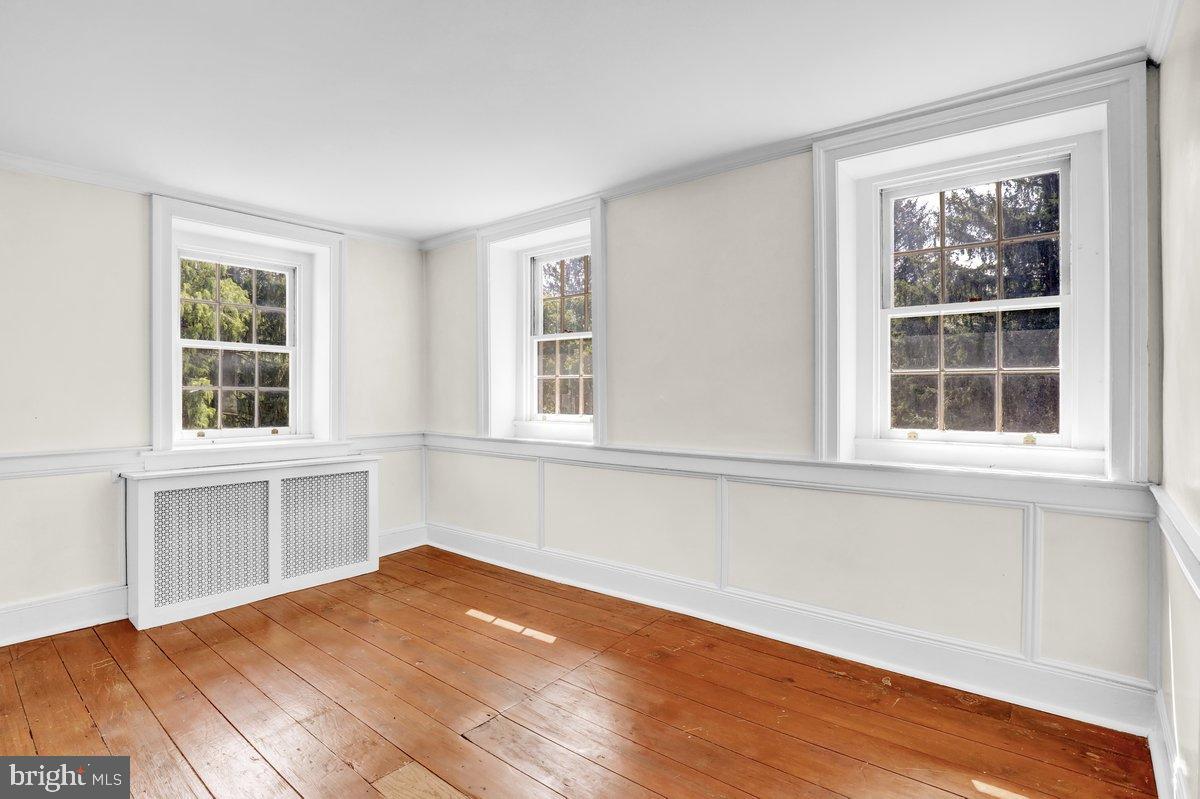 284 Old Mill Road Parkesburg, PA 19365 - Photo 30 of 50 a view of empty room with a window and wooden floor