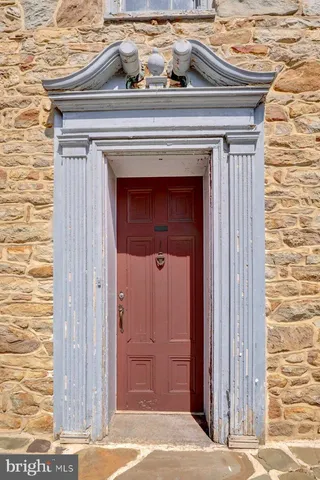 a view of a fireplace with wooden door